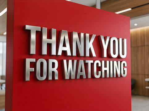 Thank you for watching sign with 3d metallic letters on orange wall