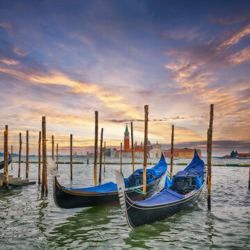 Amazing  landscape with Church of San Giorgio Maggiore  and gondolas parked beside the Riva degli Schiavoni in Venice