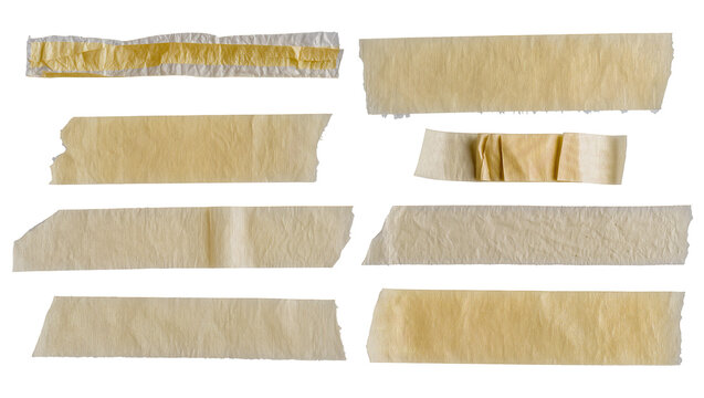 Isolated collection of beige adhesive tape strips with crumpled texture and torn edges