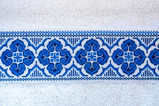 Handmade. Cross-stitch pattern on a white towel.