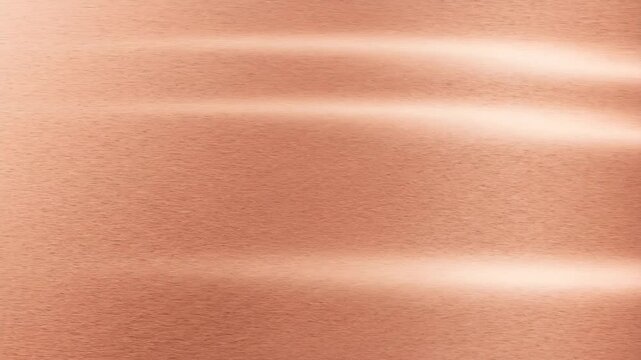 Brushed copper or rose gold metallic surface background. Shiny abstract metal texture wallpaper for luxurious design, decorative packaging, and technology backdrop.