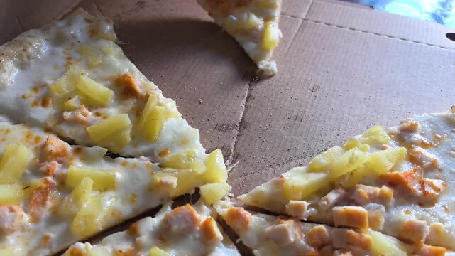 Watch as delicious homemade pizza is crafted with fresh ingredients. Each slice is loaded with gooey cheese and delightful toppings. Enjoy the process in a cozy kitchen setting.