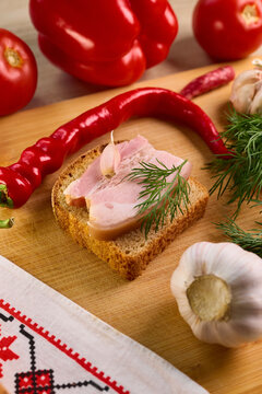 Traditional Ukrainian Feast Composition with Salo and Vegetables
