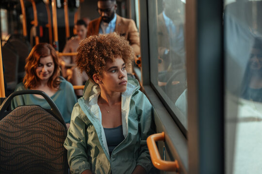 Young woman commuting on city public transport