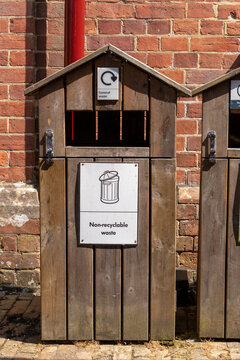 Commercial general waste bin in wooden enclosure