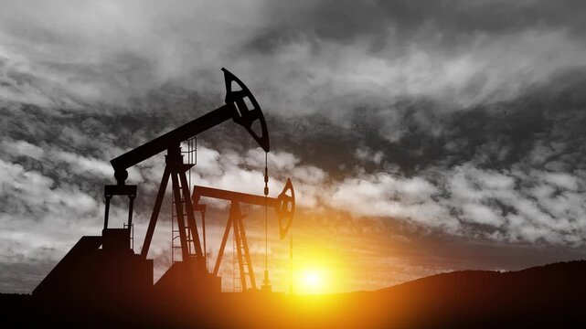 The change in oil prices caused by the war. Oil price cap concept. Oil drilling derricks at desert oilfield. Crude oil production from the ground. Petroleum production.