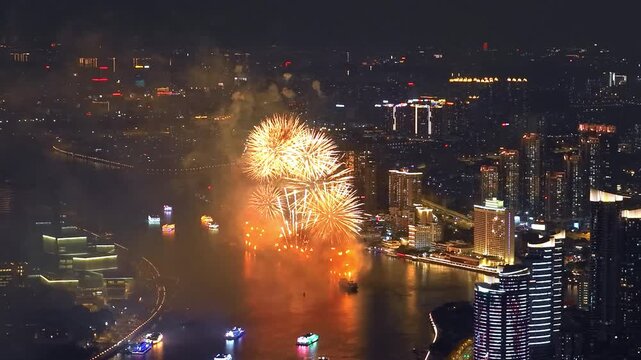 Aerial top drone view grand multi-colored fireworks display night sky over modern city. Beautiful gorgeous firecracker background. People celebrate holiday. New Year festival party. Pyrotechnics show.
