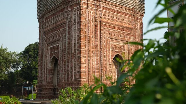 This temple is part of the Kalna Rajbari Temple complex, and its walls feature various types of intricate carvings.