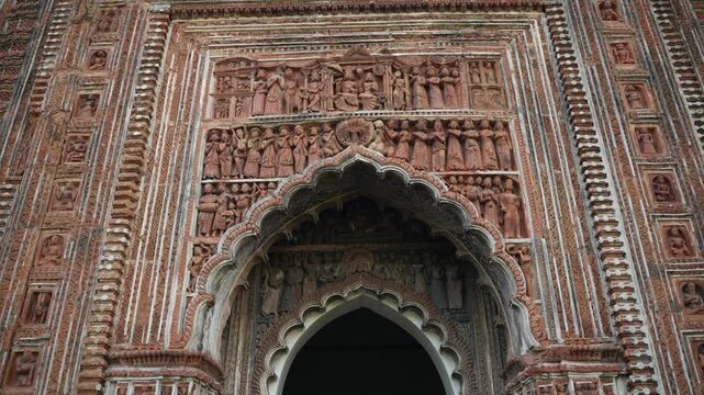 This temple is part of the Kalna Rajbari Temple complex, and its walls feature various types of intricate carvings.