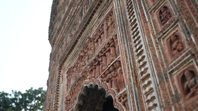 This temple is part of the Kalna Rajbari Temple complex, and its walls feature various types of intricate carvings.