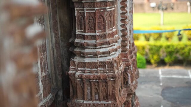 This temple is part of the Kalna Rajbari Temple complex, and its walls feature various types of intricate carvings.