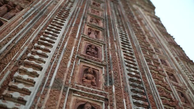This temple is part of the Kalna Rajbari Temple complex, and its walls feature various types of intricate carvings.