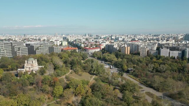 Tineretului Park And Cenusa Crematorium On Hill Bucharest City Romania Drone Track Left 4K 60FPS