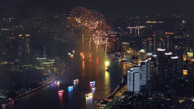 Aerial top drone view grand multi-colored fireworks display night sky over modern city. Beautiful gorgeous firecracker background. People celebrate holiday. New Year festival party. Pyrotechnics show.