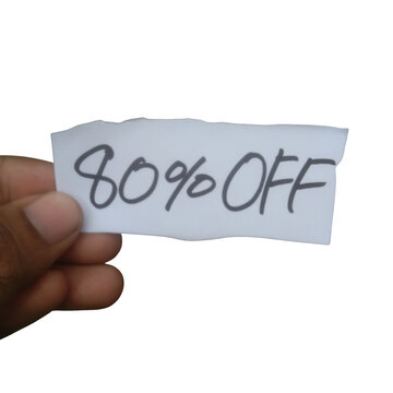Hand holding a small torn paper sign with 80 percent off handwritten text isolated on transparent background