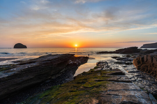 Beautiful stunning colorful vibrant Summer sunset at Trebarwith in Cornwall England
