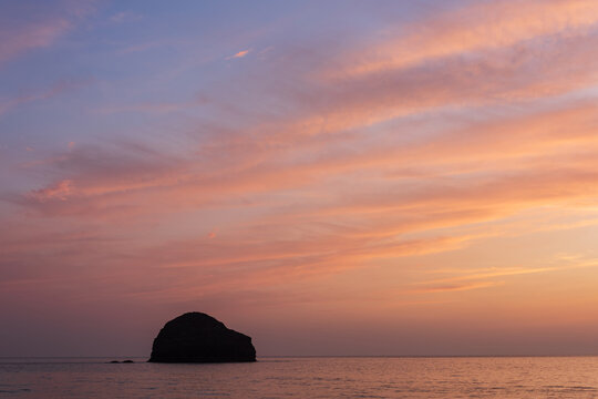 Stunning beautiful colorful vibrant Summer sunset at Trebarwith in Cornwall England