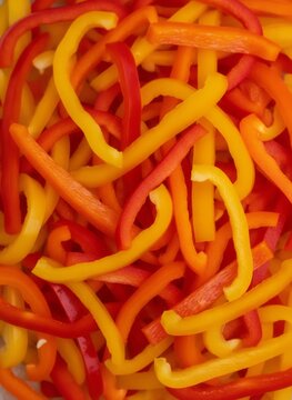 Sliced Red Yellow and Orange Bell Pepper Background Full Frame Texture