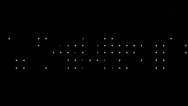 Dots arranged in a structured grid pattern glow against a deep black void to represent digital connectivity and advanced technological data networks.
