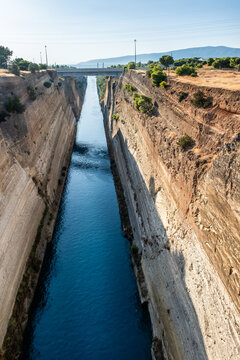 Corinth Canal, Greece. Man made canal, carved into rock; 1890, 21 meters wide, 35 meters below bridge, water is 8 meters deep.
