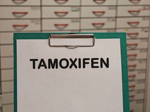 TAMOXIFEN selective estrogen receptor modulator for hormone receptor positive breast cancer displayed on a clipboard in a pharmacy