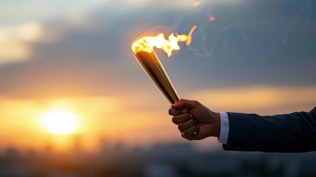 Determined Unrecognizable Person Holding Burning Torch With Flame In Hand, Stood Outdoors Against Beautiful Sunset. Representing Success And Achievement In Inspirational Moment.