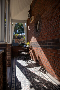 Cozy Urban Balcony Sunlit Brick Wall
