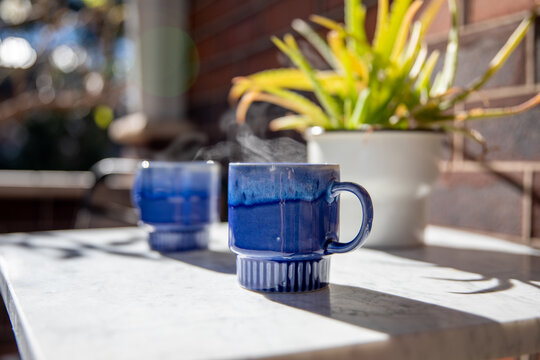 Warm Beverages On Outdoor Marble Table
