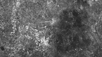 Obraz premium Black and white rough concrete texture with scattered marks and weathered details. Monochrome grunge background ideal for minimalist and abstract designs.