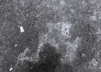 Obraz premium Monochrome aged concrete wall with peeling plaster and coarse weathered texture. Black and white distressed background for urban and vintage concepts.