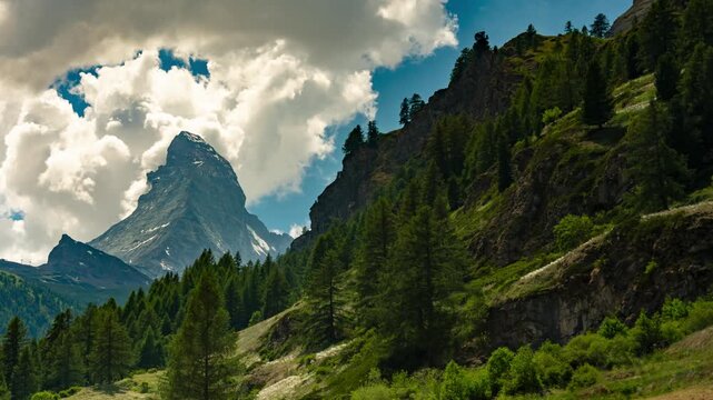 Rushing clouds over Matterhorn peak and alpine forest in Zermatt time lapse