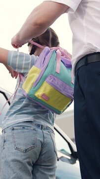 father sees off child with school backpack class, kid child girl daughter holds hand man father, man business suit sees daughter girl child school, happy family, background school building, bell class