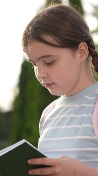 elementary school student, child goes to class holding book hand, educational program, girl schoolgirl kid child reading interesting story school book, historical facts, child kid carries book hand