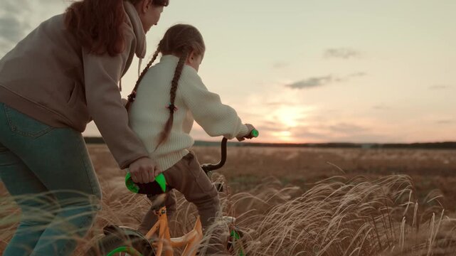 Mother and daughter adventure, Teaching balance and courage, Sunset learning session, Fresh air family time, Outdoor excitement, Personal growth, Parental encouragement, Creating lifelong memories