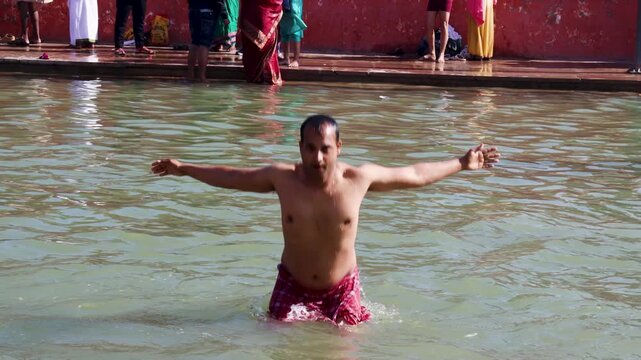young Worshipper Taking Purifying Holy Dip in Sacred River Waters