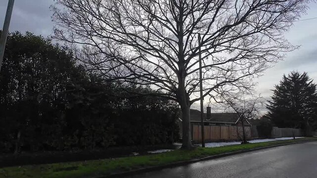 Car Drive on Luton Streets and Roads of England Great Britain After Light Snowfall. Car Mounted Wide Angle Camera Footage Was Captured During Mostly Cloudy and Rainy and After Snow Falling Day