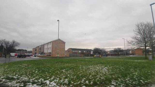 Car Drive on Luton Streets and Roads of England Great Britain After Light Snowfall. Car Mounted Wide Angle Camera Footage Was Captured During Mostly Cloudy and Rainy and After Snow Falling Day
