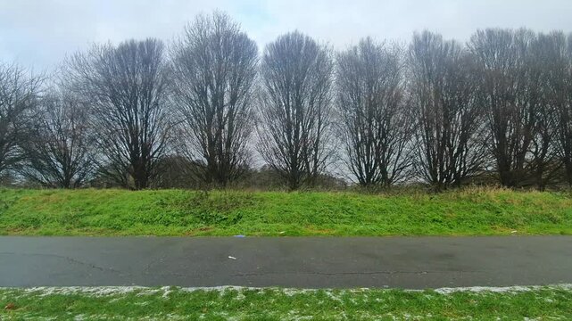 Car Drive on Luton Streets and Roads of England Great Britain After Light Snowfall. Car Mounted Wide Angle Camera Footage Was Captured During Mostly Cloudy and Rainy and After Snow Falling Day