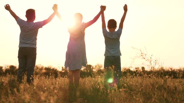 child kid boy girl schoolchildren raise their hand sunset, child kid boy girl schoolchildren big friendly team, child kid boy girl schoolchildren park sunset, children team friends, child kid boy girl
