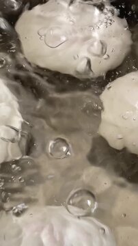 Boiling Fresh Eggs in Pot of Water on Stove