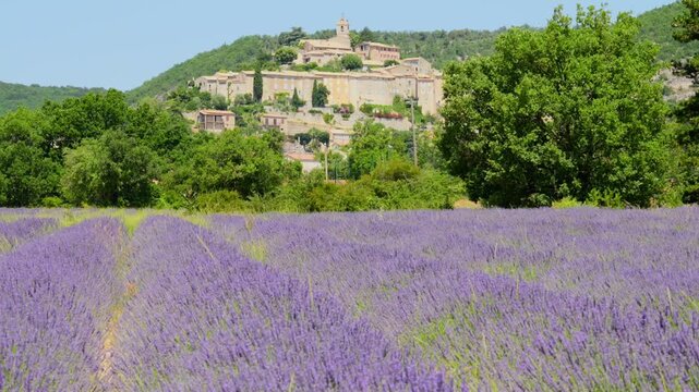 The medieval mountain village of Banon in the Alpes-de-Haute-Provence department in southern France. A picturesque setting: Banon sits perched on a hill, surrounded by vast fields of lavender