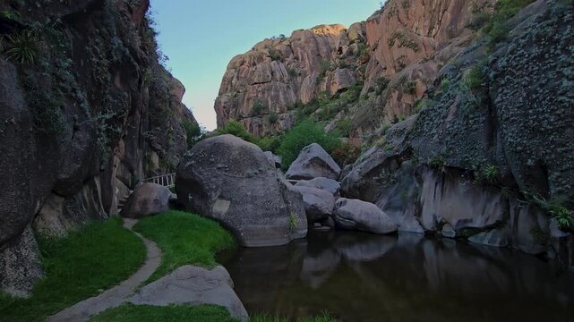Slow Panning View of Granite Rock Formations and Hiking Trail in Los Mogotes