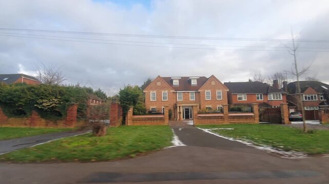 Car Drive on Luton Streets and Roads of England Great Britain After Light Snowfall. Car Mounted Wide Angle Camera Footage Was Captured During Mostly Cloudy and Rainy and After Snow Falling Day