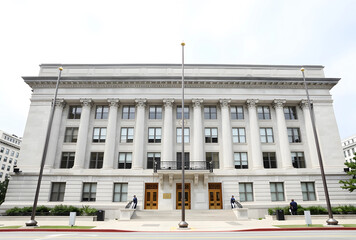 Obraz premium Classical government building facade with doric columns and grand entrance, architecture and public service