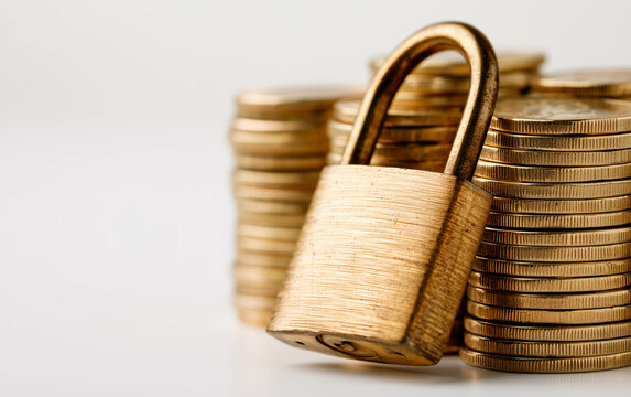 Secure Golden Coins Stack Protected by a Padlock Symbolizing Financial Safety and Investment Security