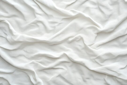 white wrinkled fabric with soft folds and gentle shadows evoking a calm cozy minimalist mood