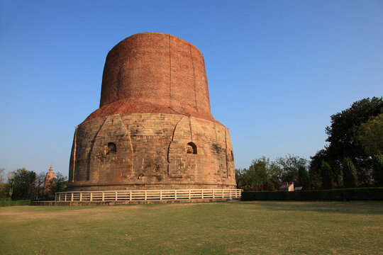 The Dhamek Stupa at Sarnath, Uttar Pradesh, India, an ancient Buddhist monument marking the site where Buddha delivered his first sermon