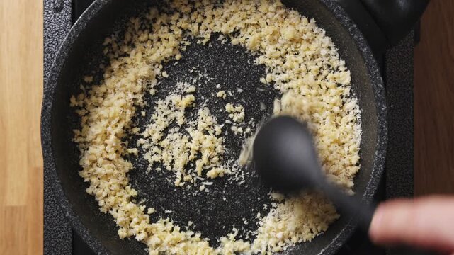 
Panko and chopped nuts toast together in frying pan for coating. Crunchy panko topping works well for fish, chicken or vegetables. Crunchy panko crust adds golden texture to homemade dinner recipes.