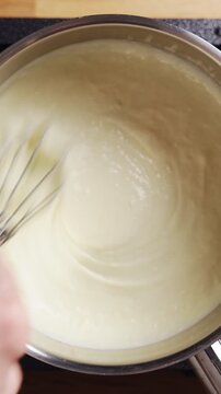 Grated parmesan stirs into sauce, melting into creamy texture. Parmesan sauce pairs perfectly with grilled chicken or roasted meat. Creamy parmesan sauce turns chicken dinner into gourmet meal.
