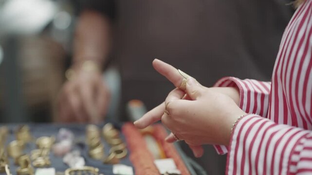 Woman Trying Ring at Street Market in Palermo, Italy